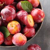 plums on bowl