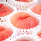 Korean White Peaches in package netting